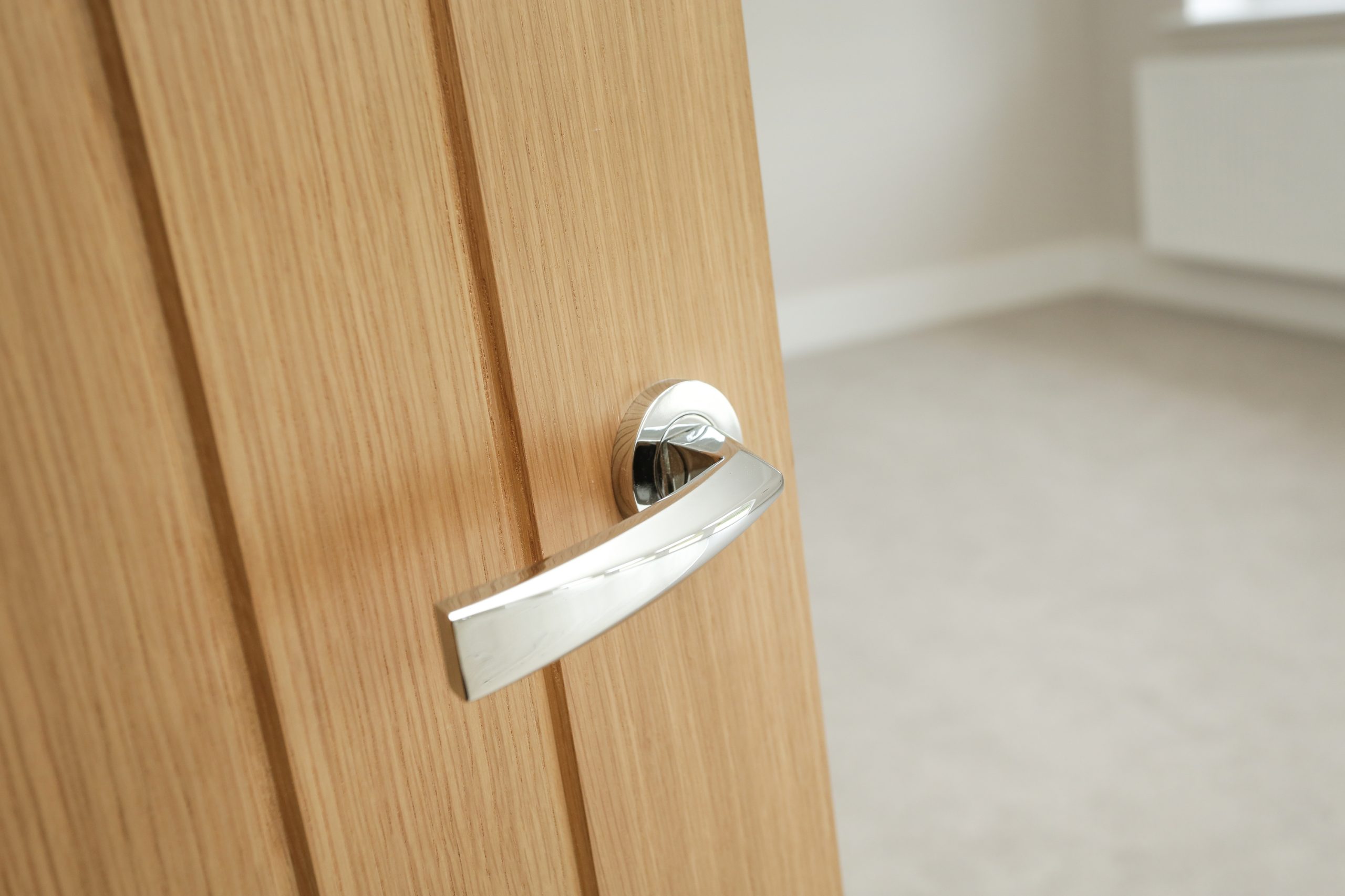 Oak door with chrome fitted handle at our Woodside court development.