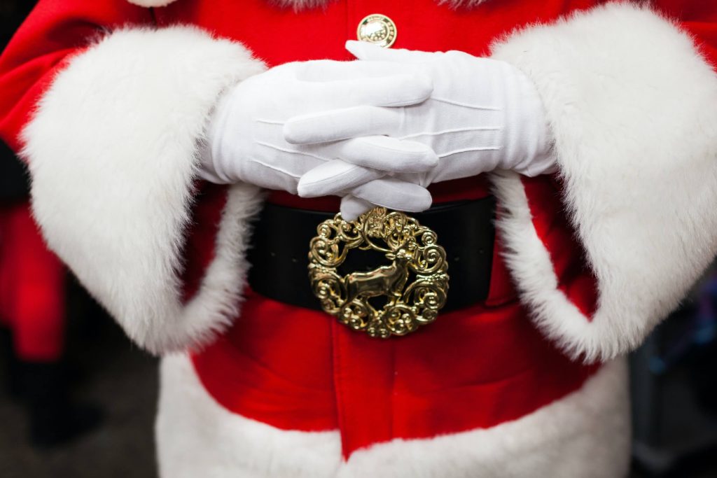 Santa Claus with gold belt and white gloves